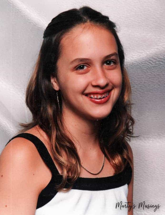 Teenage girl with long hair and braces