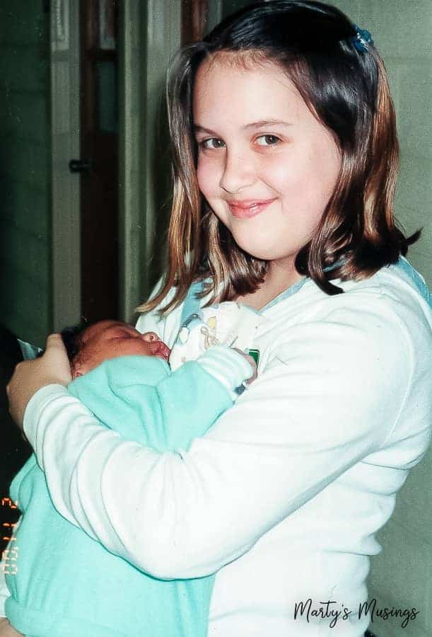daughter holding baby