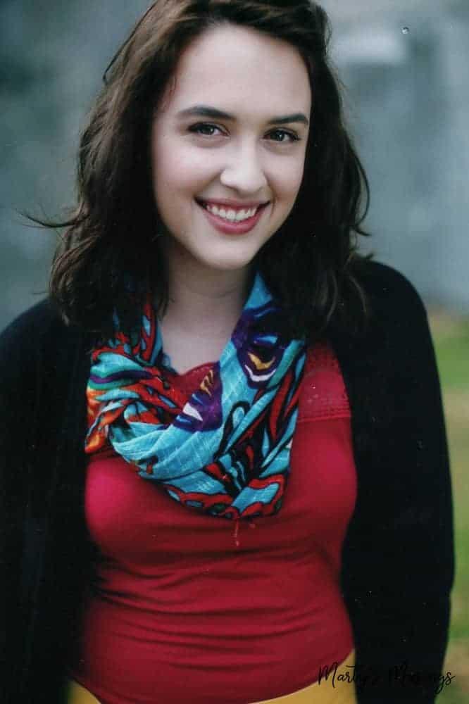 young woman dressed up with red shirt and scarf