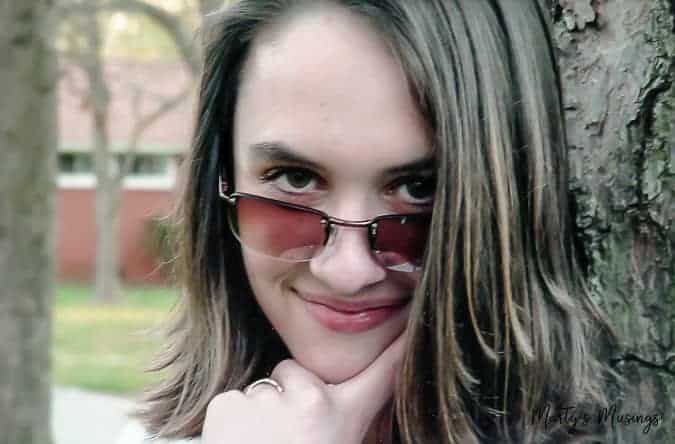 Teenage girl with short hair and sun glasses on