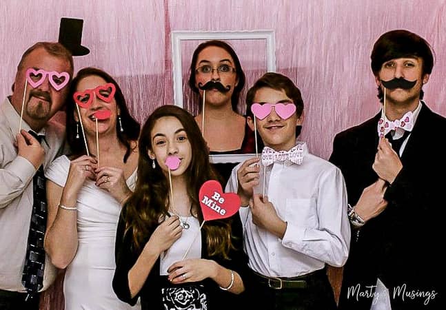 Valentine's Day photo booth with family celebrating silver anniversary