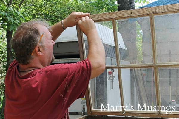 A man standing in front of a window