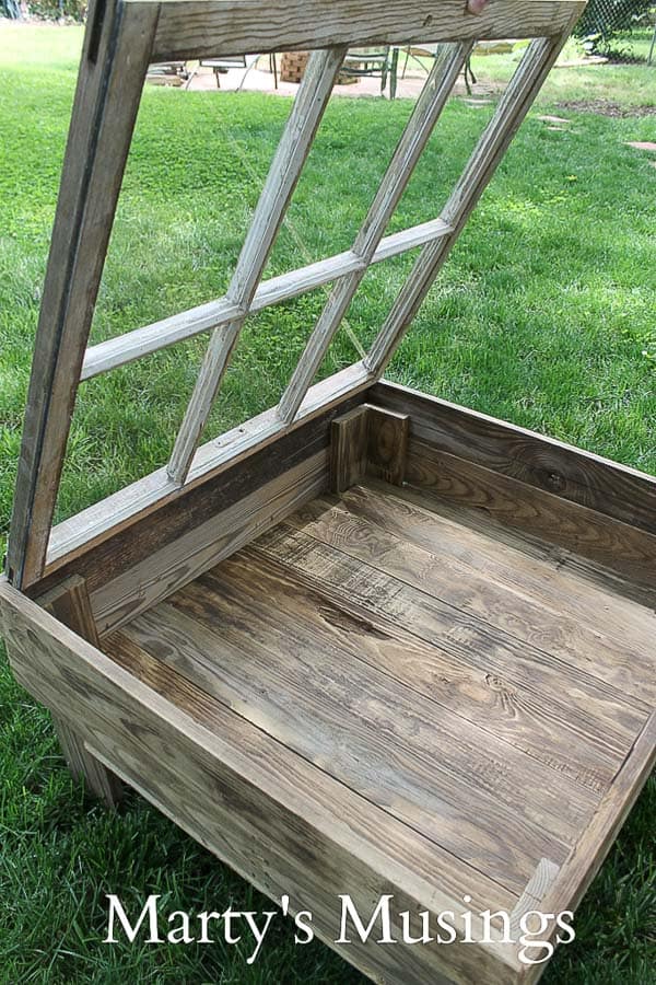 A wooden bench sitting in the grass