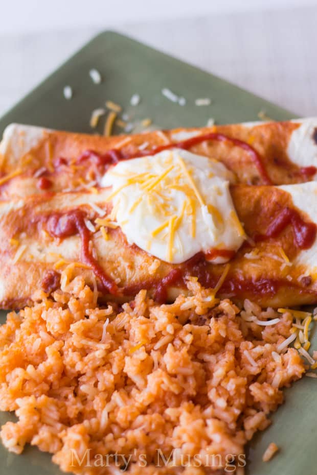 A plate of food, with Enchilada and Beef