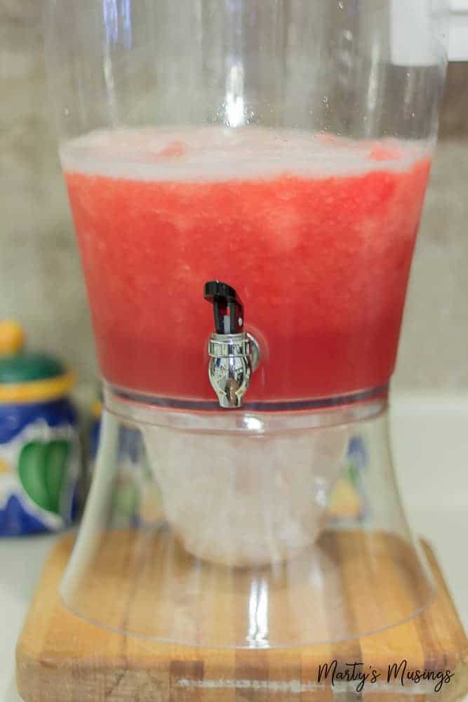 Red frozen punch in dispenser