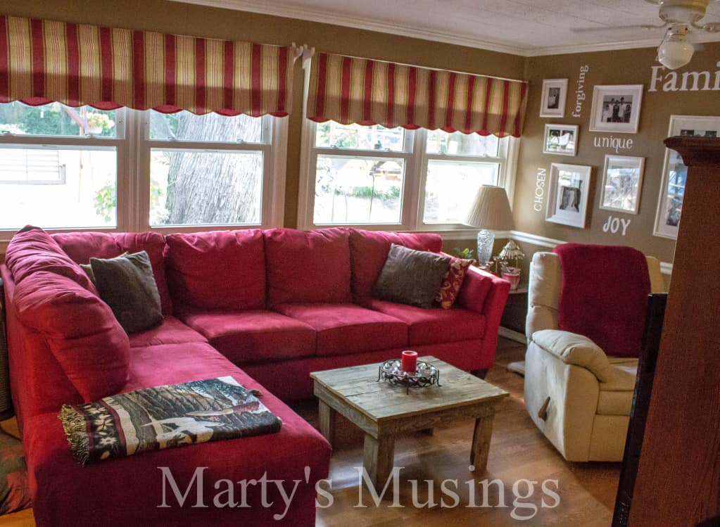 A living room filled with furniture and a fire place