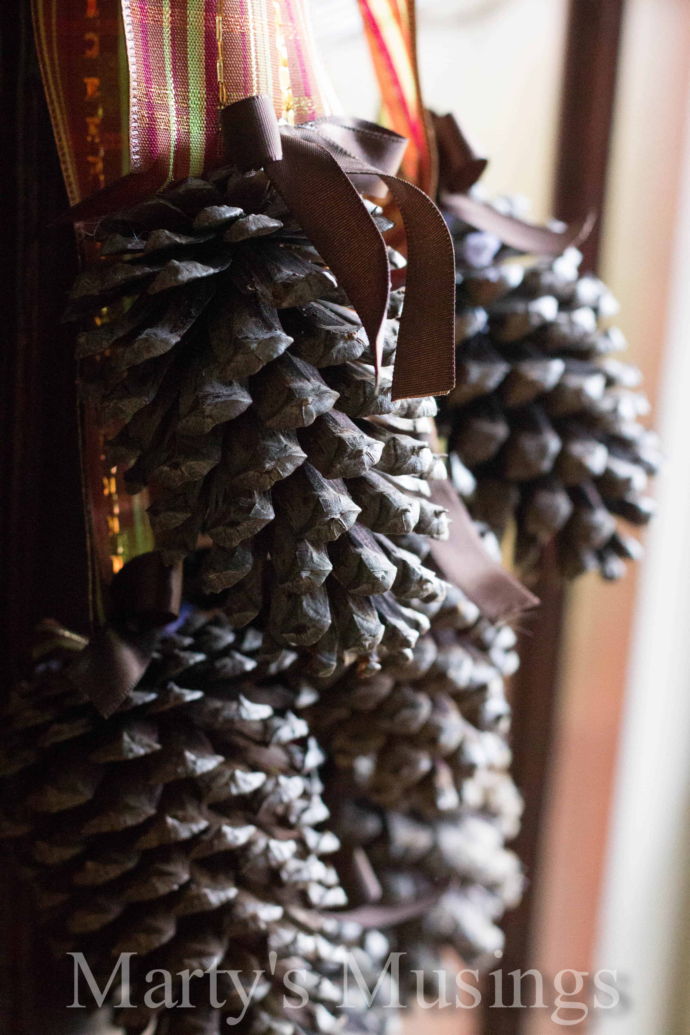 Pinecone Door Arrangement Group Of Pinecones Photographed Close Up Attached By Small Ribbon To Striped Glitter And