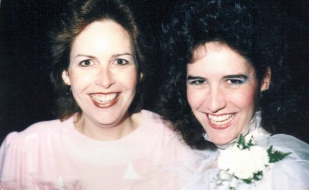 two sisters in wedding attire