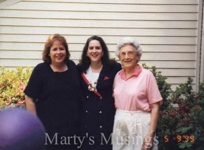 A person standing in front of a group of people posing for the camera, with My Sister Brenda