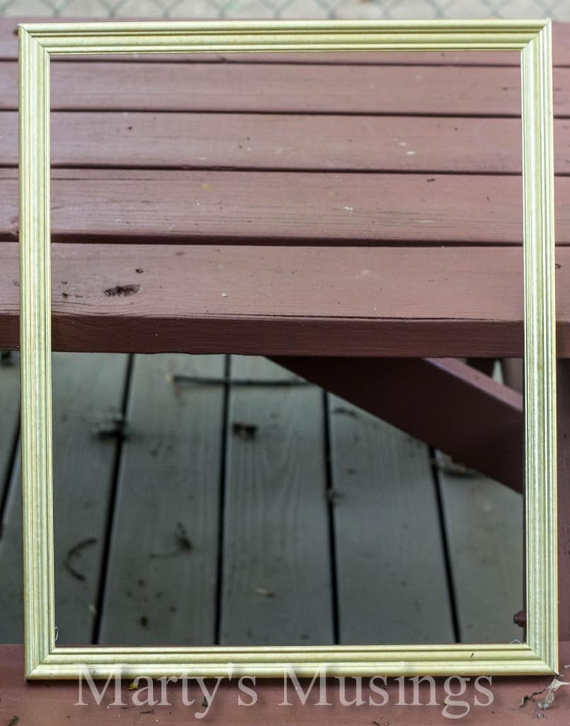 A wooden bench sitting on the side of a building