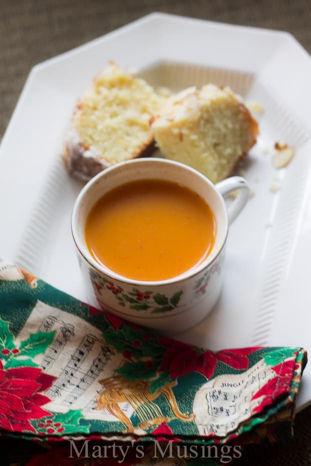 A tray of food with a Christmas mug of  Russian tea