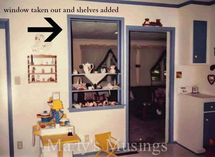 Old kitchen with blue trim and teapots for decoration