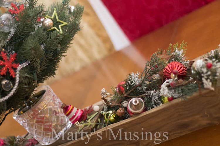 A vase filled with flowers sitting on top of a wooden table