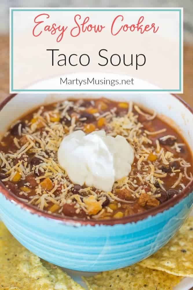 A bowl of food on a plate, with Soup and Beef