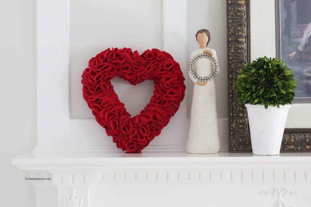 Red handmade heart on mantel