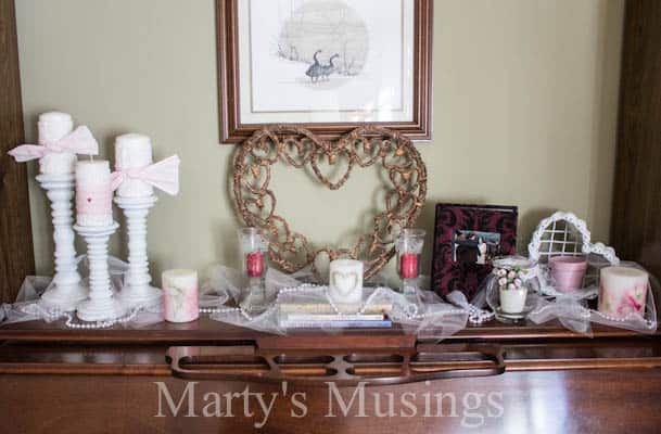 A room filled with furniture and vase on a table