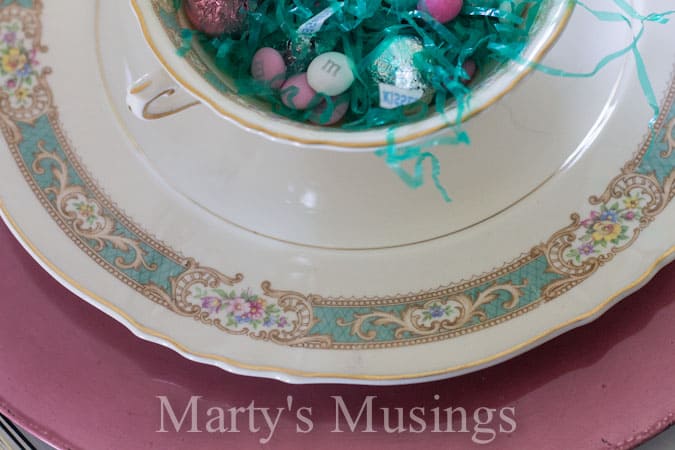 A bowl of food on a plate, with Table and China