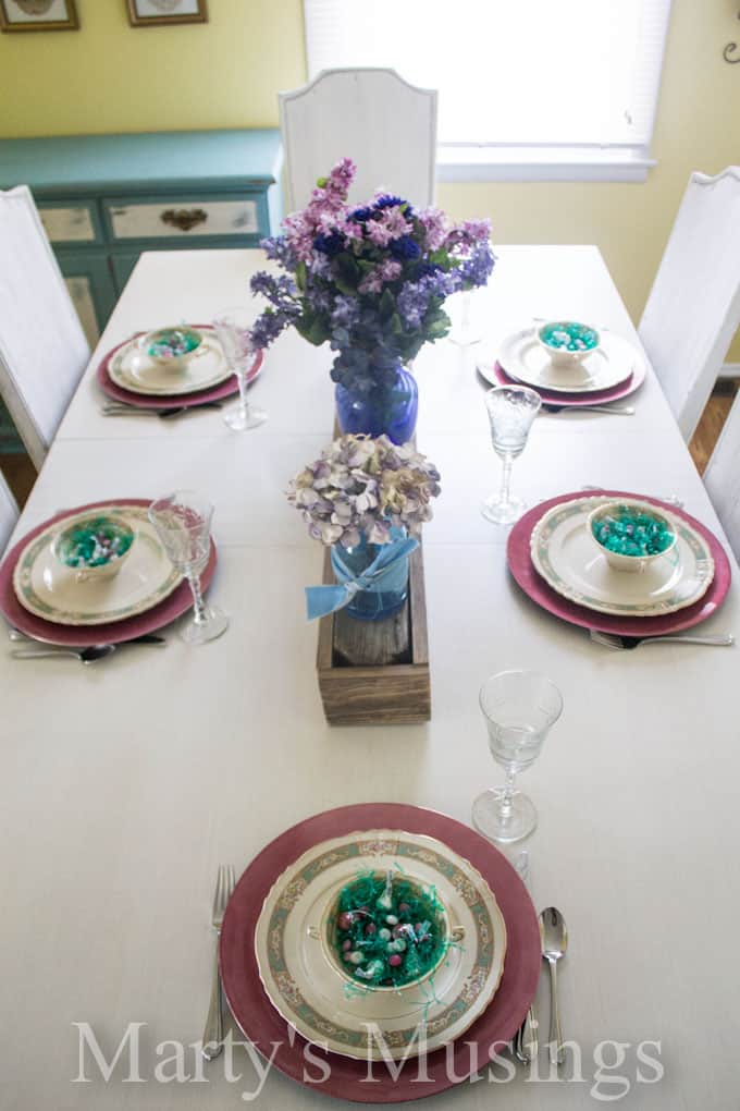 A dining table with a plate of food, with Kitchen and Paint