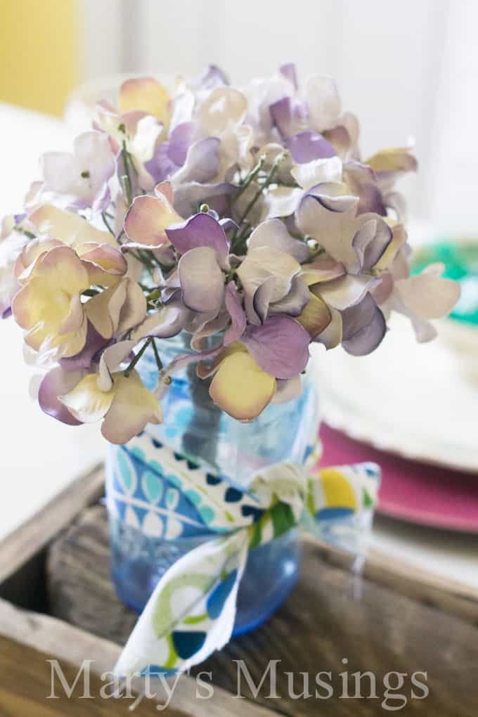 A vase filled with flowers sitting on a table