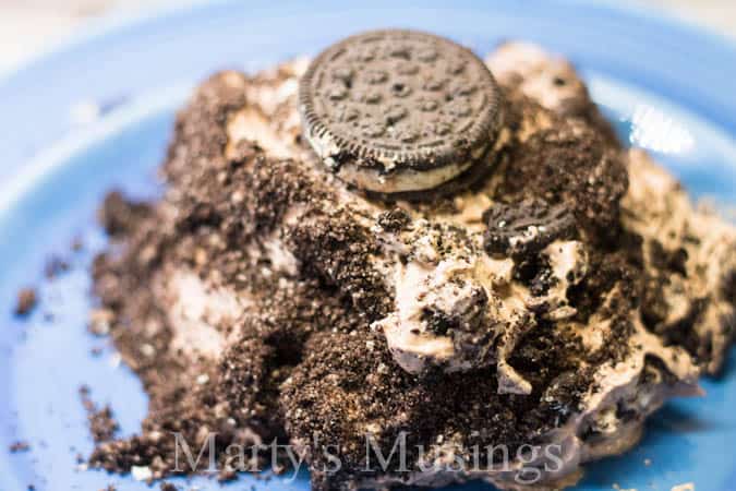 Blue plate with oreo dirt cake on it