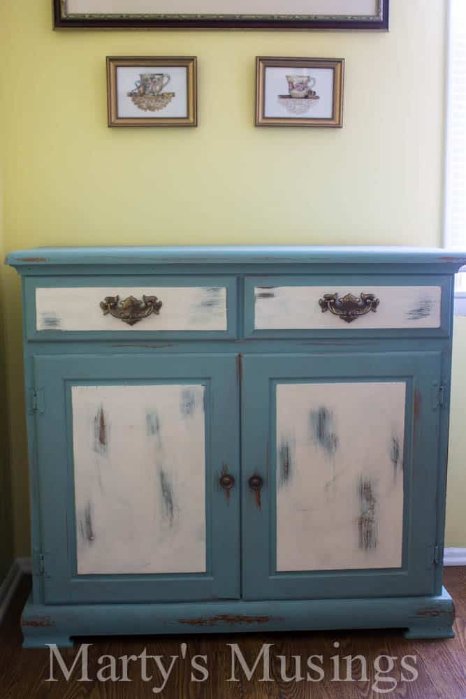 Chalk paint is the poor man's answer for a furniture makeover! Check out the chalk painted kitchen buffet, hutch and accessories!