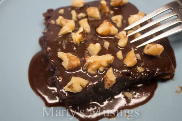 A piece of cake and ice cream on a plate, with Chocolate