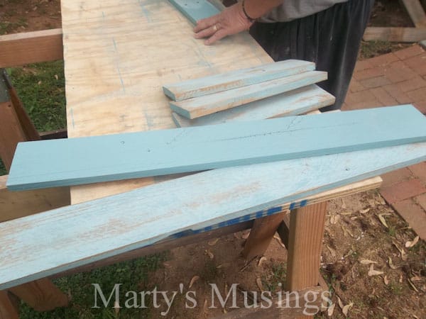 A person sitting on a wooden bench