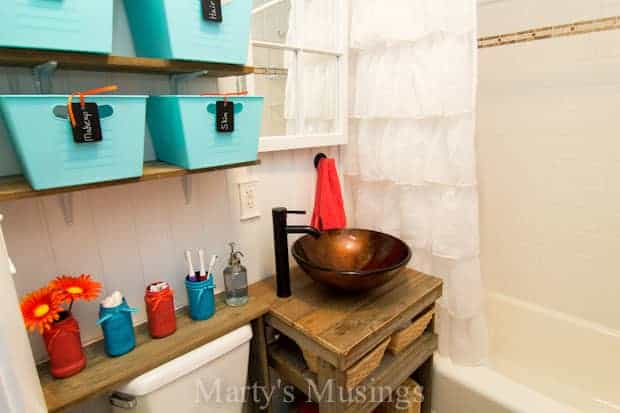 This small bathroom remodel combines frugal tips on storage with DIY repurposing projects while creating a rustic, one of a kind space.