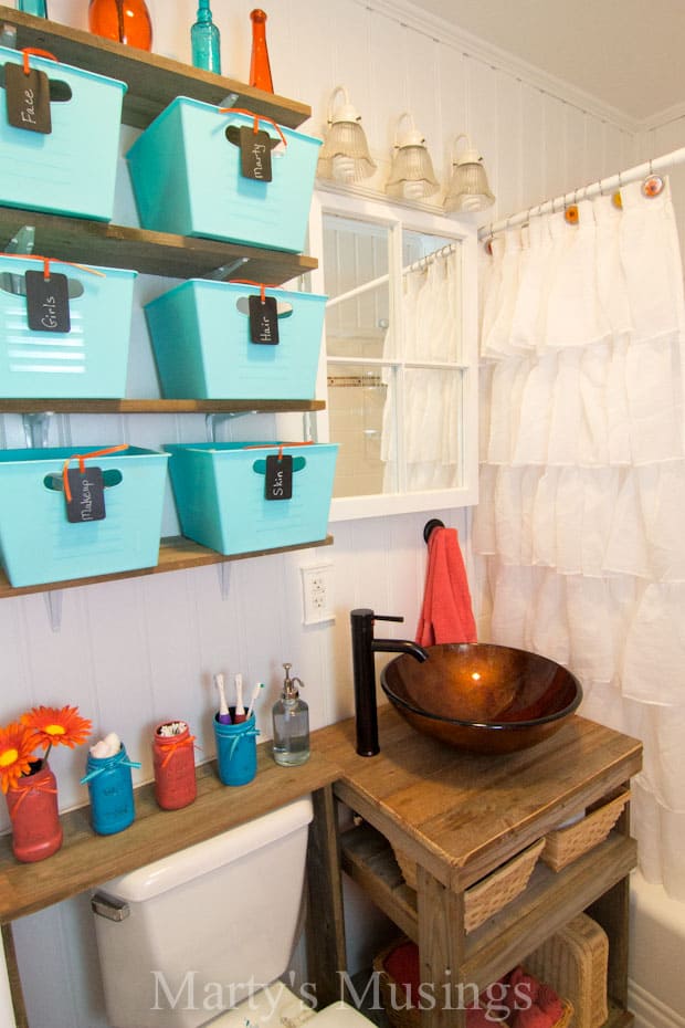 Rustic small bathroom with blues and corals