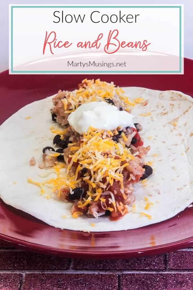 slow cooker rice and beans on tortilla on red plate