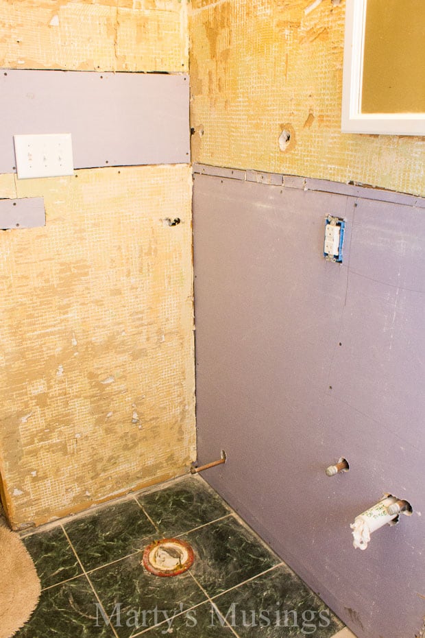 New sheetrock around old tile in small bathroom