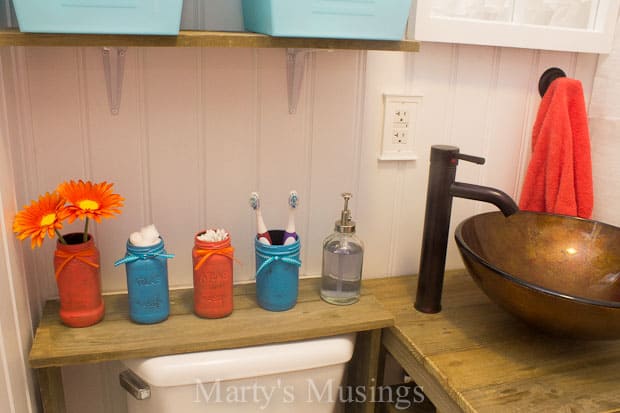 Rustic bathroom with coral and blue