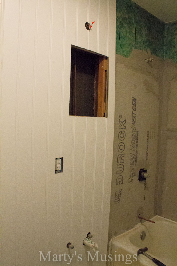 Beadboard paneling next to shower