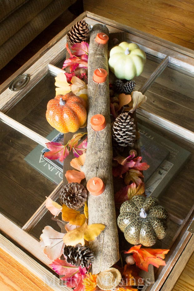 A bunch of stuffed animals sitting on top of a wooden table