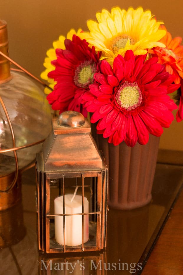 A vase filled with flowers sitting on a table