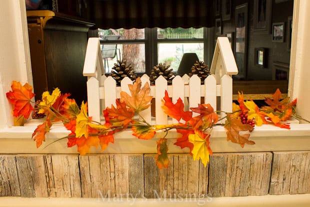 A vase of flowers sitting on top of a wooden table