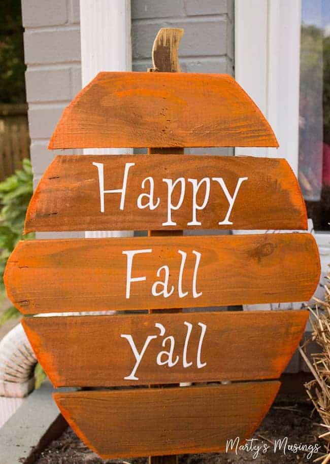 Made from leftover wood, these DIY rustic fence board pumpkins are fun, inexpensive and easy to complete with spray paint and vinyl letters.