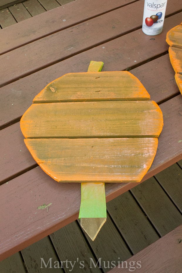 Wooden pumpkin spray painted orange