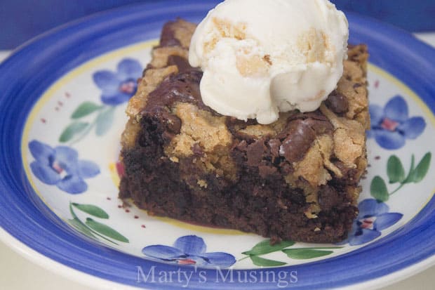 A piece of cake and ice cream on a plate, with Chocolate and Cookie