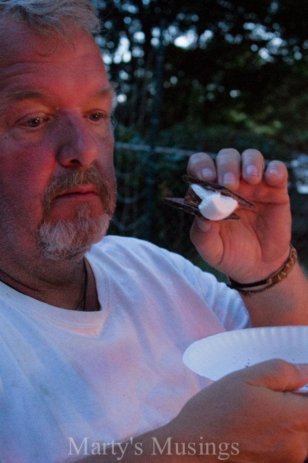 A close up of a man in a blue shirt