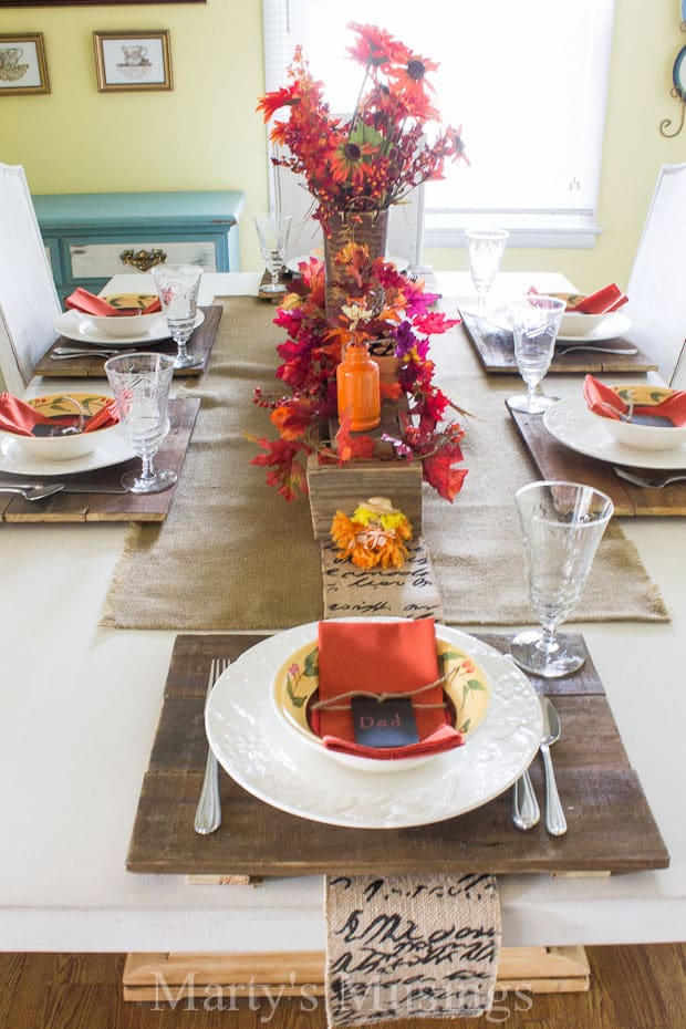 Dining table with fall tablescape and burlap table runner