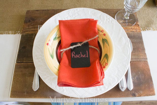 Rustic wood charger with white plate and fall napkins