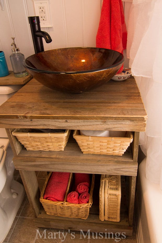 A stove top oven sitting inside of a bowl, with Bathroom