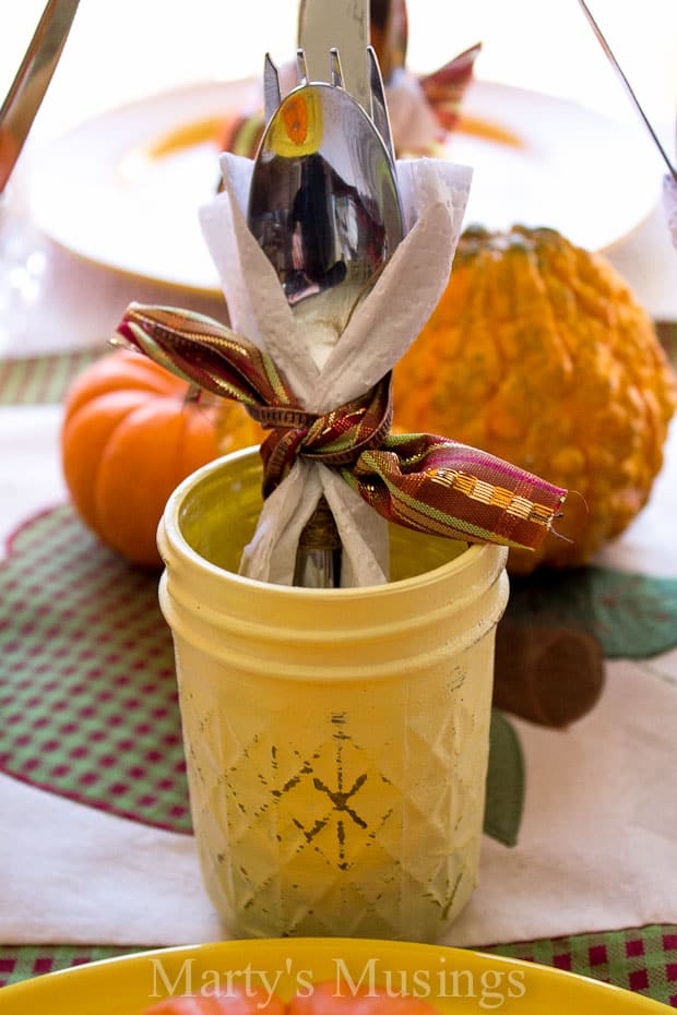 A cup of coffee and a glass of orange juice, with Thanksgiving