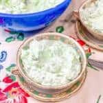A bowl of food on a table, with Watergate salad