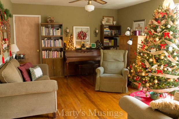 A living room filled with furniture and a christmas tree