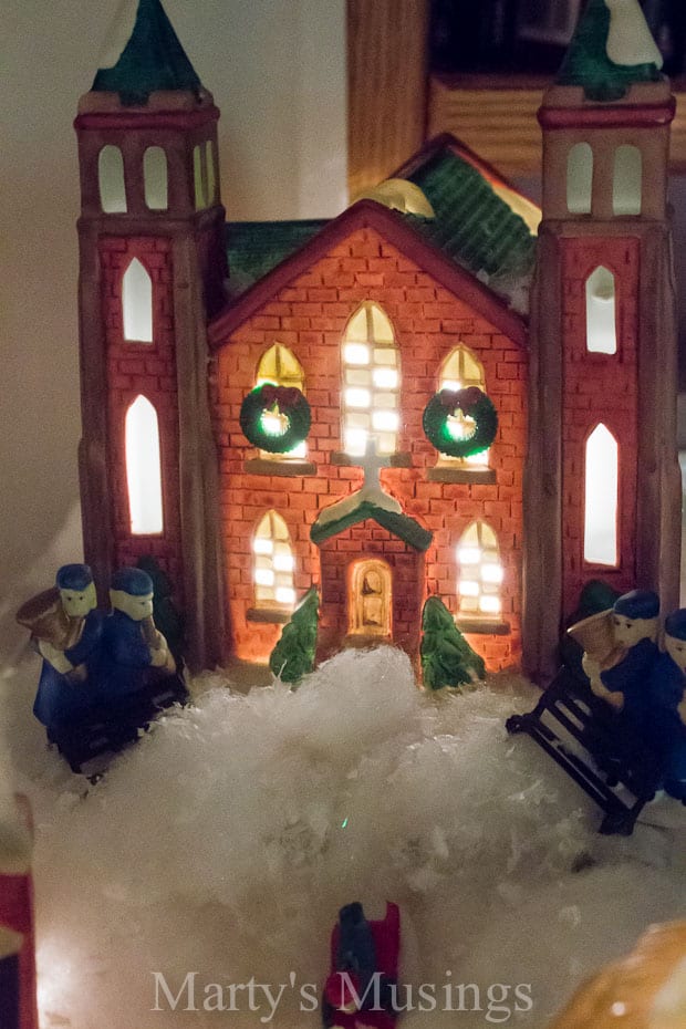 Miniature village church with snow