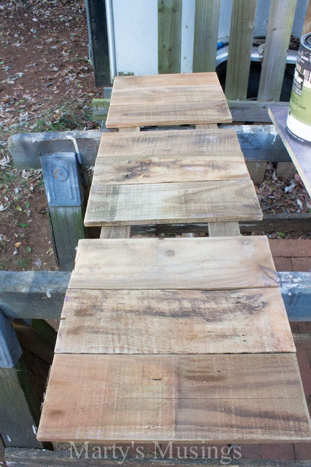 A wooden bench sitting on top of a table