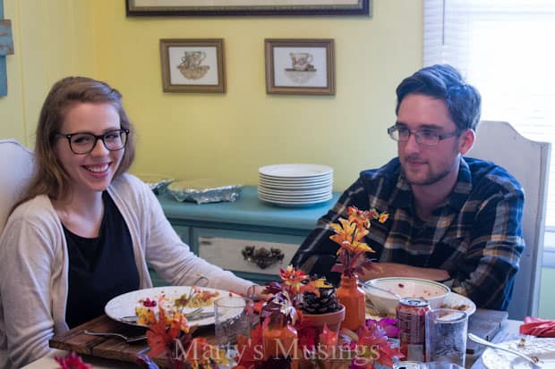 A group of people sitting at a table eating food