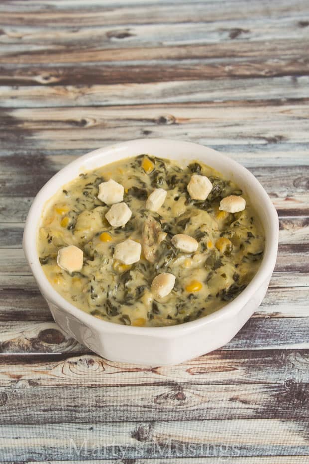 A bowl of chicken and spinach gnocchi soup